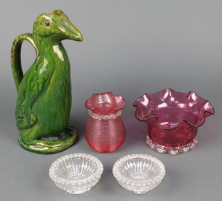 A Victorian cranberry bowl with wavy rim 6", a ditto ribbed baluster vase 3 1/2", 2 clear glass table salts and a studio green glazed griffin jug