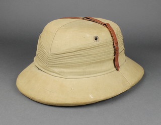 A 1930's Pith helmet size 7 1/2
