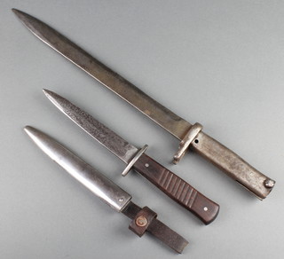 A First World War German fighting dagger the blade marked Gottlieb Hammesfahr Solingen with 6" blade complete with scabbard together with a First World War Erstaz bayonet with 12" blade 