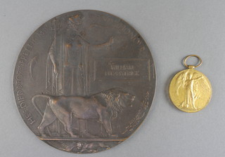 A Victory medal and Death plaque to 15047 Private William Fitzpatrick Royal Lancashire Regt. 