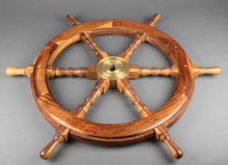 A teak and brass 6 spoked ships wheel 28 1/2" diam. 