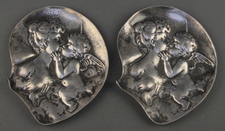 Two Art Nouveau embossed pewter pin dishes decorated mother and cherub, the reverse marked 224 4 1/2" 