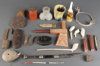 A 19th Century horn beaker 3 1/2", a carved "hardstone" Tomahawk marked Dakota 14" (shaft f), various clay pipes and curios 