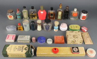 A bottle of Vaseline hair tonic, a  bar of Trafford soap, bar of Lifebuoy soap and various other toiletry jars etc 