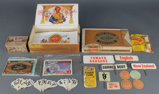 Four cardboard milk bottle lids, 36 pre-decimal shield shaped price signs 2", 5 small food display signs - Cornedbeef, English, New Zealand, Tomato Sausage and, 9d, a carton of Blakey's leather plugged quarter tips etc 