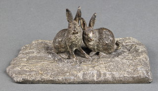 A bronze figure of 2 seated hares 1 1/2" x 4" x 2 1/2" 