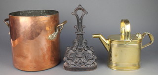 A 19th Century oval copper twin handled pan 10", a Victorian brass hot water carrier 6" (some dents) and a Victorian cast iron door stop 12 1/2" 