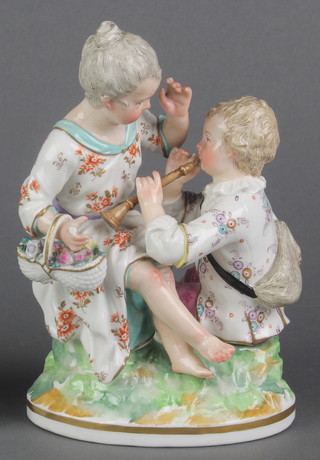 A 19th Century German group of a mother and child on a raised base 7" 
