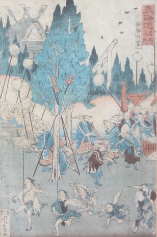 Japanese coloured wood block print of revellers in a garden landscape, signed 12 1/2" x 8" 