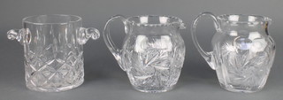 A cut glass wine cooler together with 2 ditto jugs 