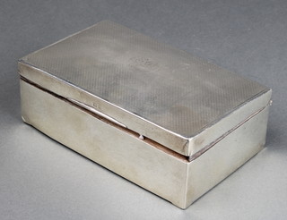 A silver engine turned cigarette box with inscription 5 1/2" 