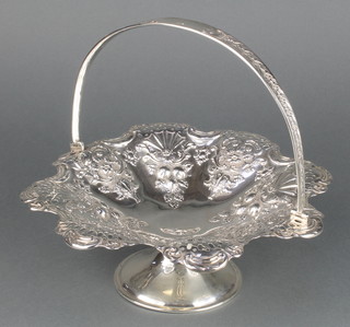 A Victorian repousse silver swing handled basket with floral and fruit decoration Sheffield 1899 9" 