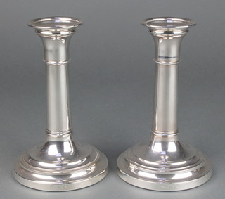 A pair of silver candlesticks with banded decoration Maker M C Hesrey & SonsLondon 1998, 6" 