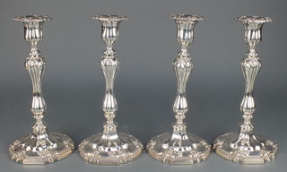 A set of 4 silver plated candlesticks with waisted stems and beaded decoration 10 1/2" 