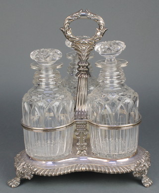 A Victorian silver plated 3 bottle decanter stand with 3 glass decanters 
