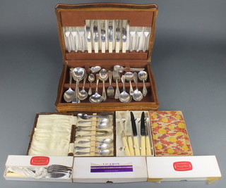 An oak canteen containing mixed silver plated cutlery, 5 cased sets 