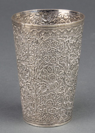 A Persian silver beaker with floral decoration 82 grams 3 1/2 "