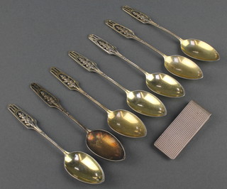A set of 6 silver gilt Continental silver coffee spoons with pierced handles and a silver money clip 85.3 grams