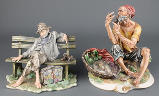A Capodimonte figure of a fisherman smoking a pipe 10", ditto of a  tramp sleeping on a bench 8" 
