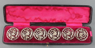 A set of 6 Victorian cast silver buttons with floral decoration Birmingham 1900, contained in a fitted case
