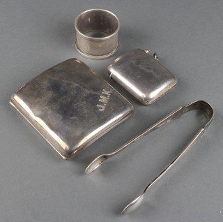An Edwardian silver vesta case of plain form, a cigarette case, a pair of nips and napkin ring 202 grams