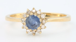 An 18ct yellow gold sapphire and diamond cluster ring size M 