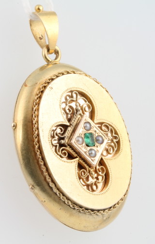 A Victorian gold pearl and emerald set locket 