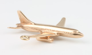 A 9ct yellow gold charm in the form of an airliner 3.3 grams