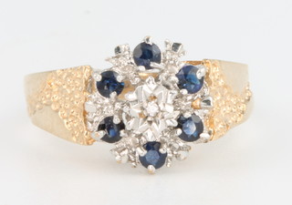 A 9ct yellow gold sapphire and diamond ring with fancy shank size N 