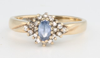 A 9ct yellow gold blue stone and diamond cluster ring, size J 