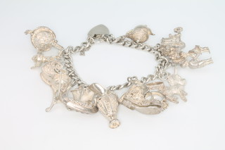 A silver charm bracelet, 76 grams