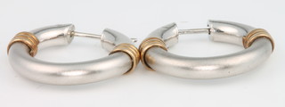 A pair of 2 colour gold hoop earrings 3.8 grams