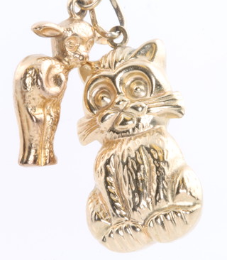Two 9ct yellow gold charms in the form of a deer and cat 2.7 grams