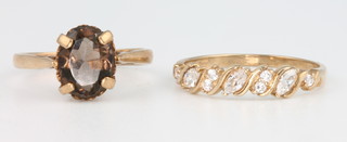 A 9ct yellow gold diamond set ring size M 1/2, a ditto quartz set ring size J