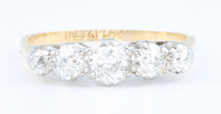 An 18ct yellow gold graduated 5 stone diamond ring size L 1/2