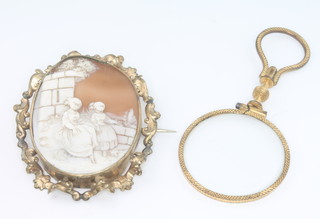 A Victorian gilt cameo brooch and a gilt eye glass