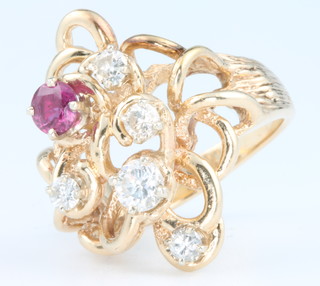 A yellow gold diamond and ruby open ring size L 