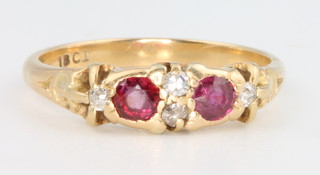 An 18ct yellow gold ruby and diamond ring size N