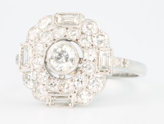 An 18ct white gold Edwardian style cluster ring with brilliant and baguette cut diamonds 1.25ct, size N 