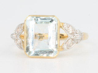 An 18ct white gold aquamarine and diamond ring with open shank, size L 