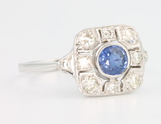 An 18ct white gold Edwardian style sapphire and diamond ring, the centre stone approx. 0.4ct enclosed by brilliant cut diamonds approx. 0.55ct, size N 