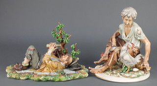 A Capodimonte figure of a reclining tramp beside a tree 12", a ditto of a tramp beside a chicken 10" 
