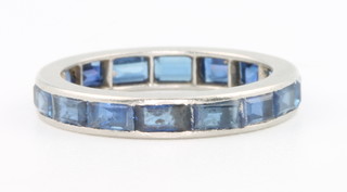 A platinum baguette cut sapphire eternity ring, size K 