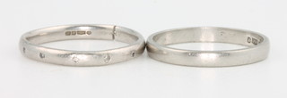 Two platinum wedding bands, 1 set with diamonds, both size K 