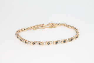 A 9ct yellow gold sapphire and diamond bracelet 