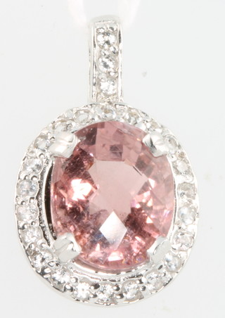 A 9ct white gold rose quartz and diamond pendant
