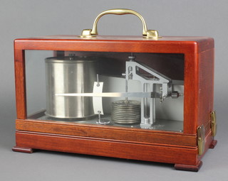 A Casella 3123/T1 barograph, as new and with instructions, dated 4 December 1978, contained in a mahogany case