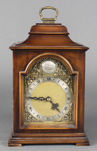 An Elliott Georgian style bracket clock, the 3 1/2" arched gilt dial with silvered chapter ring, contained in a shaped mahogany case, raised on bracket feet  