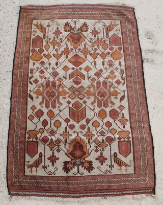 A white and brown ground Baluch rug with birds in vines 57" x 34"  
