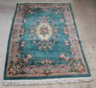 A green ground and floral patterned Chinese carpet 121" x 83" 